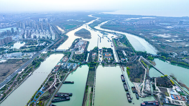 Aerial River Cityscape with Canals, Bridges and Barges