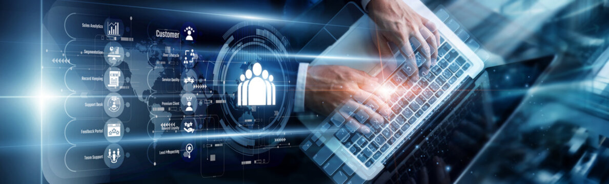 Specialist using a laptop to analyze CRM software data inputs. This development refines customer relationship management strategies, boosting client retention through personalized engagement.