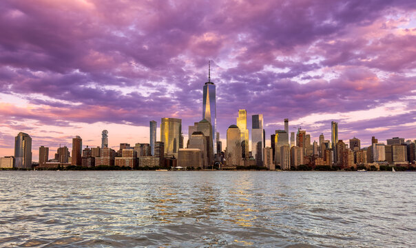 Wide-angle panoramic view of the iconic New York City skyline in the early evening