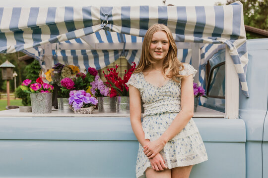 girl with truck and flowers