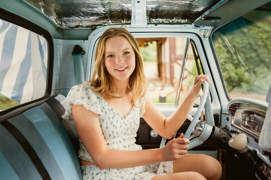 young woman driving a truck