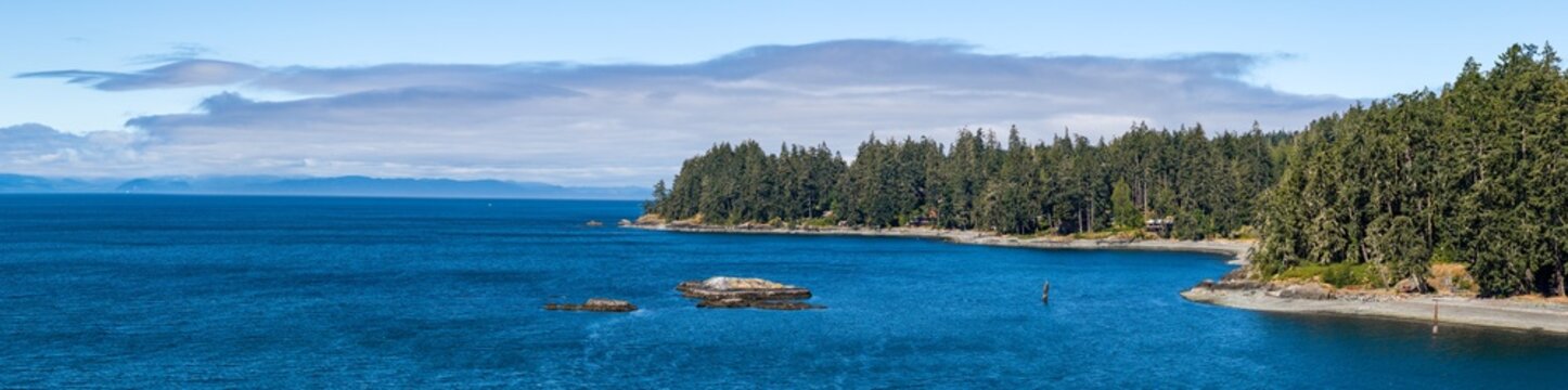 Sooke Coastline on Vancouver Island, British Columbia, Canada &mdash; Rocky Shoreline With Evergreen Forest and Blue Ocean