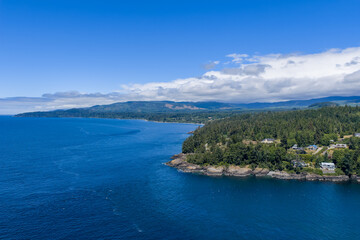 Naklejka premium Aerial Ocean Coastline Over Otter Point and Sooke Forests on Vancouver Island, British Columbia