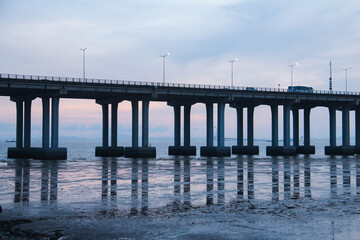Fototapeta premium Bridge Over Water at Dusk