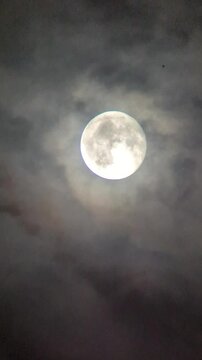 full moon over the clouds