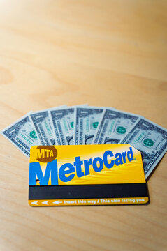 Barcelona, Spain. June 28, 2026, MTA MetroCard with US dollar bills, representing its rising value for collectors and its place in New York City's transit history