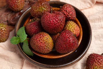 Fresh Lychees in Bowl with Mint Leaves © NguyenNhat