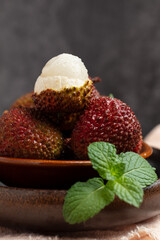 Fresh Lychee Fruit with Mint Leaves in Bowl © NguyenNhat