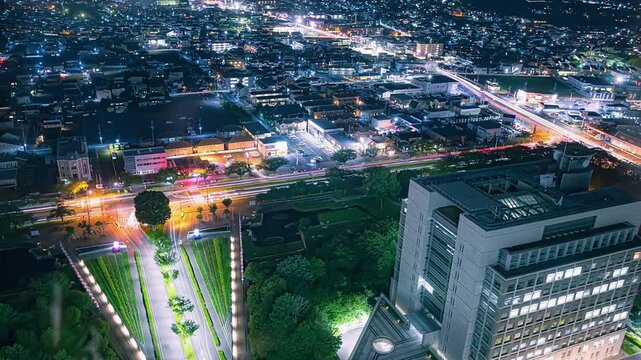 Night view time lapse overlooking the illuminated cityscape and busy roads in Mito city,Ibaraki, Japan