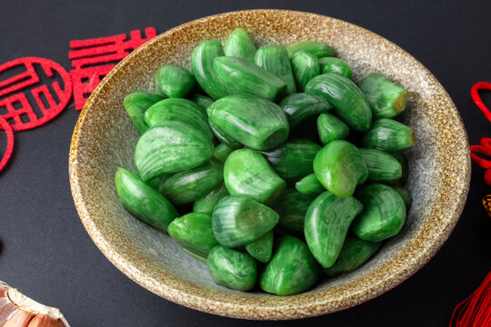 Chinese Laba Garlic in Bowl with Festive Red Decorations