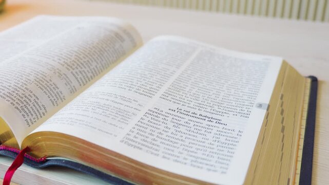 High angle close up of open French holy bible book