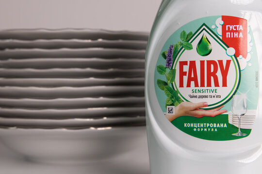 Fairy Sensitive Tea Tree and Mint dishwashing liquid white plastic bottle on grey background