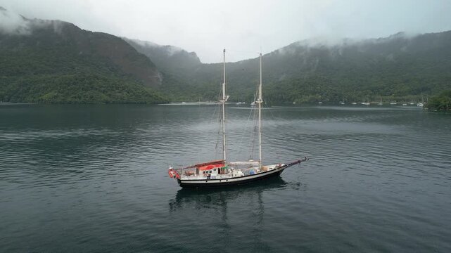 Big sailing boat anchored in the calm bay