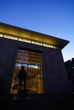 The Sir Walter Raleigh statue in front of the convention center in downtown Raleigh, North Carolina at night