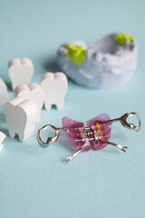 Correcting dental alignment in children is a medical concept. Orthodontic plate with an orthodontic screw for widening a child's upper jaw.  © dore art