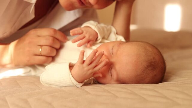 Mom and the newborn baby are at home.