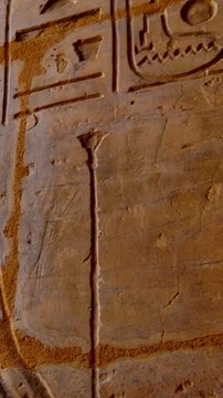 Close-up of detailed hieroglyphic rows with cartouches carved in stone lintel at Seti I temple Luxor Egypt.