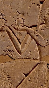 Close-up of detailed hieroglyphic rows with cartouches carved in stone lintel at Seti I temple Luxor Egypt.