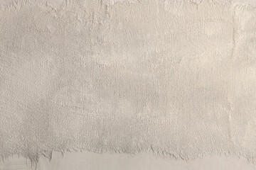 Torn, ripped blot crack crumble paper, fabric rustic canvas pieces collage. Gray, beige white copy space grunge dirty relief texture poster background. © Liliia