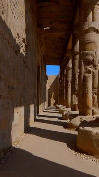 Osiride colonnade with hieroglyphic wall at Seti I mortuary temple, Luxor Egypt