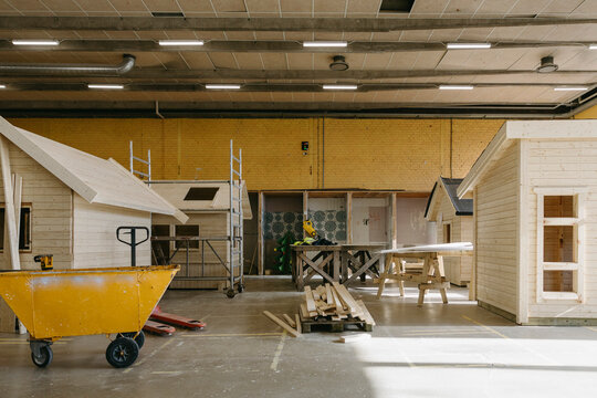 Wooden sheds and logs at construction workshop in vocational school