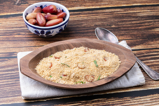 Fafora de pinh&atilde;o, typical brazilian sidedish on a bowl over wooden table