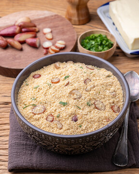 Fafora de pinh&atilde;o, typical brazilian sidedish on a bowl over wooden table