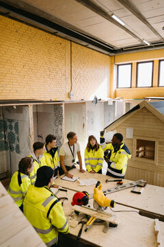 High angle view of construction training workshop of students being held by teacher in workshop at vocational high schoo