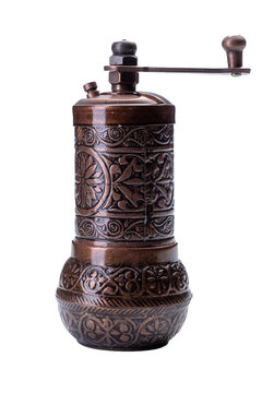 Traditional oriental copper pepper grinder isolated on white background