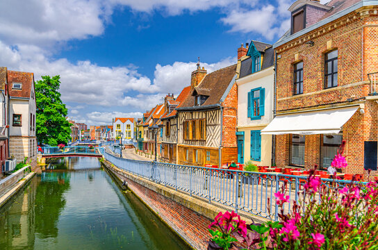 Saint-Leu quarter with traditional fachwerk houses and brick buildings on embankment of Somme river water canal with bridges in Amiens historical city centre, Hauts-de-France Region, Northern France