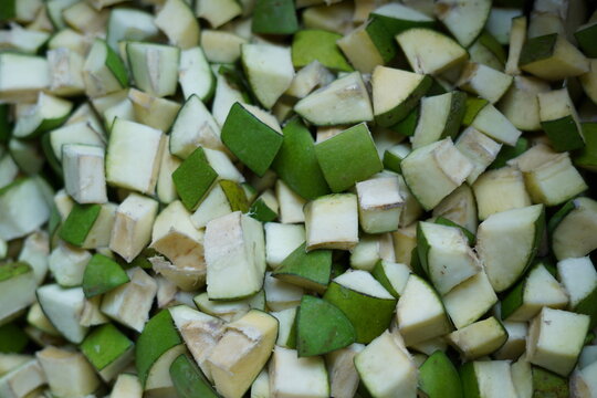 Top down view of diced raw mango cubes ready to be pickled