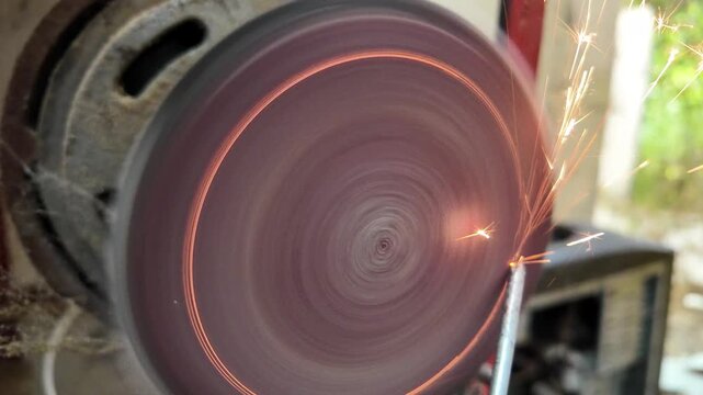 Close-up view of sharpening. 4K Metal Spark.