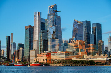 Fototapeta premium Skyscrapers of Hudson Yards skyline viewed from the river. Modern glass towers including the Edge observation deck rise above the Manhattan waterfront in New York.
