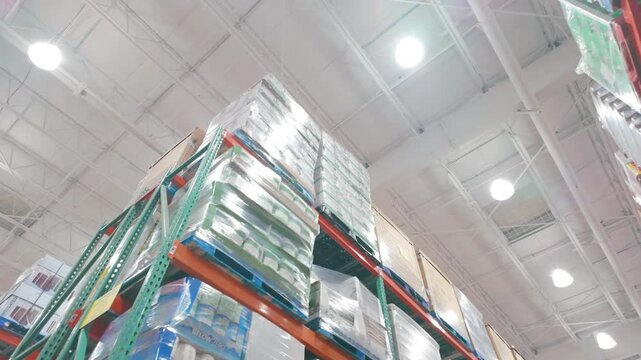 Langford, BC, Canada - June 28, 2026: Commercial warehouse storage racks with shrink wrapped pallets