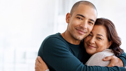 Obraz premium Happy mother and son embracing with genuine smiles, showcasing a strong family bond and affection