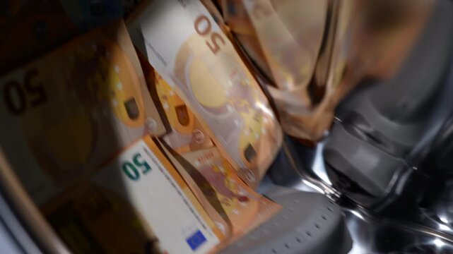 Money laundering concept. Euro banknotes spinning inside a washing machine drum, a powerful conceptual video representing money laundering, illegal financial activities, tax evasion, and corruption