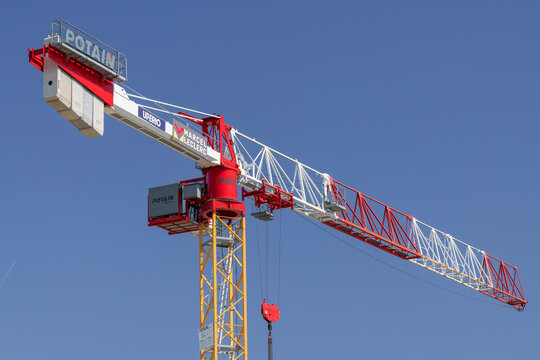 Nancy, France - June 20th 2026 : View on a flat-top tower crane Potain MDT 219 J10 on a construction site for the construction of a building.