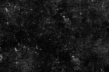 Fototapeta premium Grungy black surface with numerous white scratches and dust particles, creating a distressed and textured overlay for abstract or vintage designs.