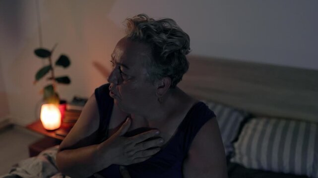 Overweight Sad Mature Woman Touching Hair Waking From Nightmare In Bed At Night