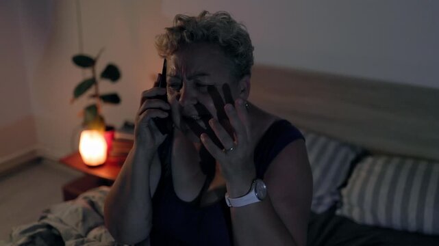 Overweight Mature Woman Calling Emergency For Heart Pain In Dark Bedroom