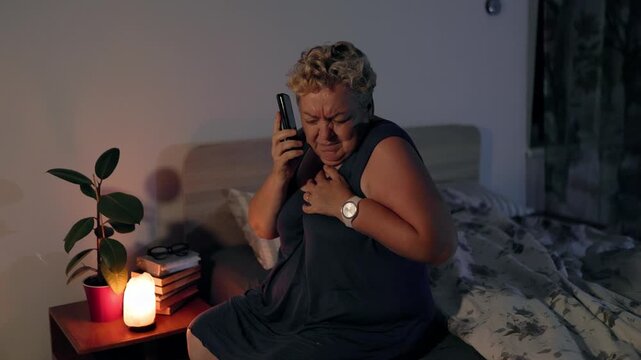 Overweight Worried Mature Woman Having Heart Attack Calling Help At Night