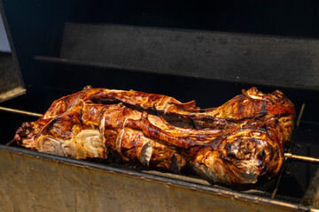 Whole roasted lamb on spit grill Chvalovice Czechia © Richard Semik