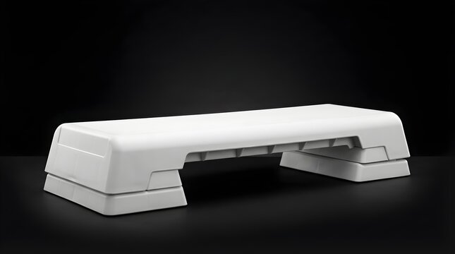 White aerobic step platform for cardio fitness exercise workouts, gym equipment for strength training and healthy lifestyle