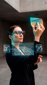 Businesswoman using augmented reality glasses with holographic city navigation display