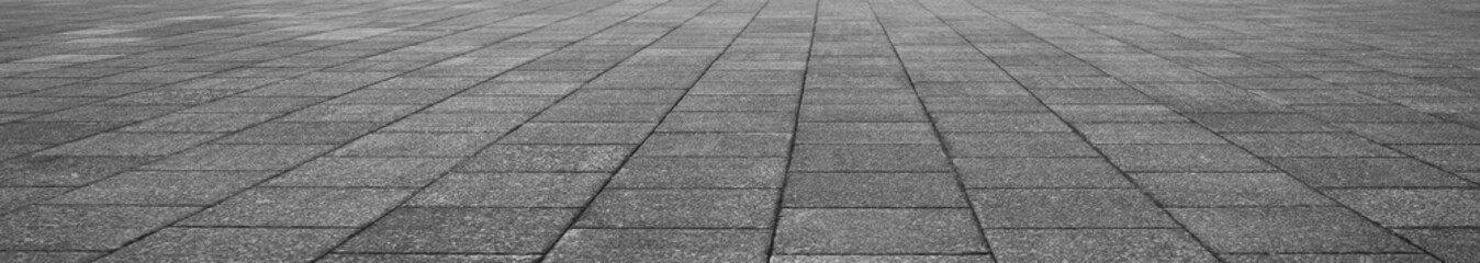 Fototapeta premium empty stone floor top in perspective. grey tile floor background in perspective view. line. empty copy space stone street. pavement. Granite outdoor tiled floor. gray granite. Marble texture