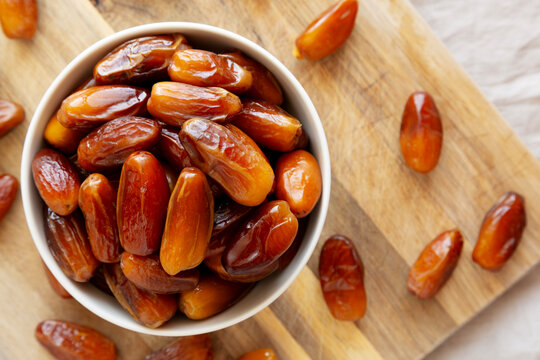 Algerian Dates Deglet Nour in a Bowl, top view. Close-up.