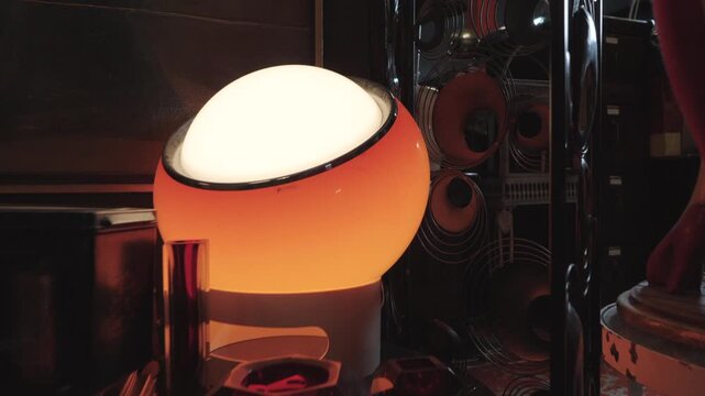 Vintage and Retro deco with furnitures: smooth angle on rounded lamp and a table [180&deg; shutter angle n&deg; 8/10 Series 35mm and 22mm] from 10 bits ProRes 442 - Slog 3 and Sony GM & G