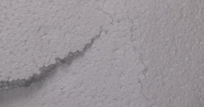 White foam with a broken line, sheet foam with a compressed foam structure shows a deep furrow on its plane.