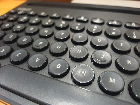 Selective focus on a black chiclet keyboard layout showcasing the classic QWERTY keys layout.