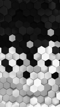 Black and white background of patterned hexagons. Smooth moving 3d rendered hex shapes creating a visual of sleek elegant motion for futuristic scientific or technical backgrounds. 3d render loop.